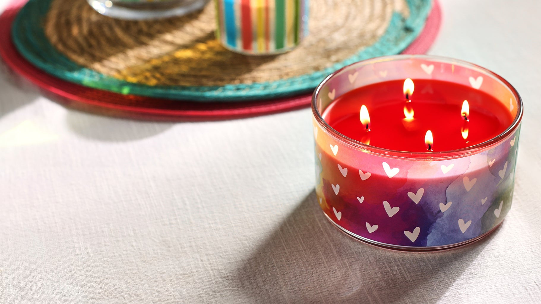 Lit Love is Love Sangria Sunset 4-Wick Specialty Jar Candle on a table